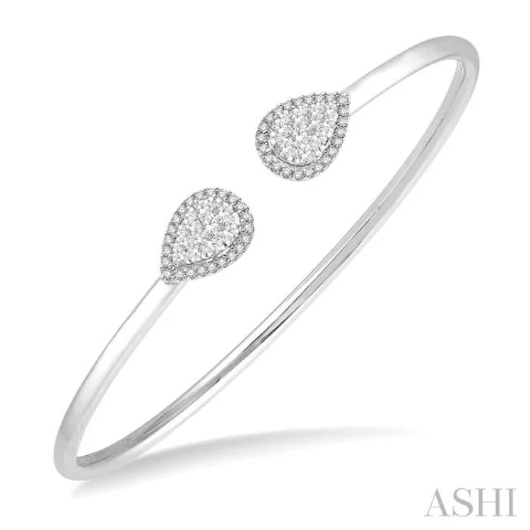 women's radiant cut necklace-5/8 Ctw Pear Shape Lovebright Open Cuff Diamond Bangle in 14K White Gold